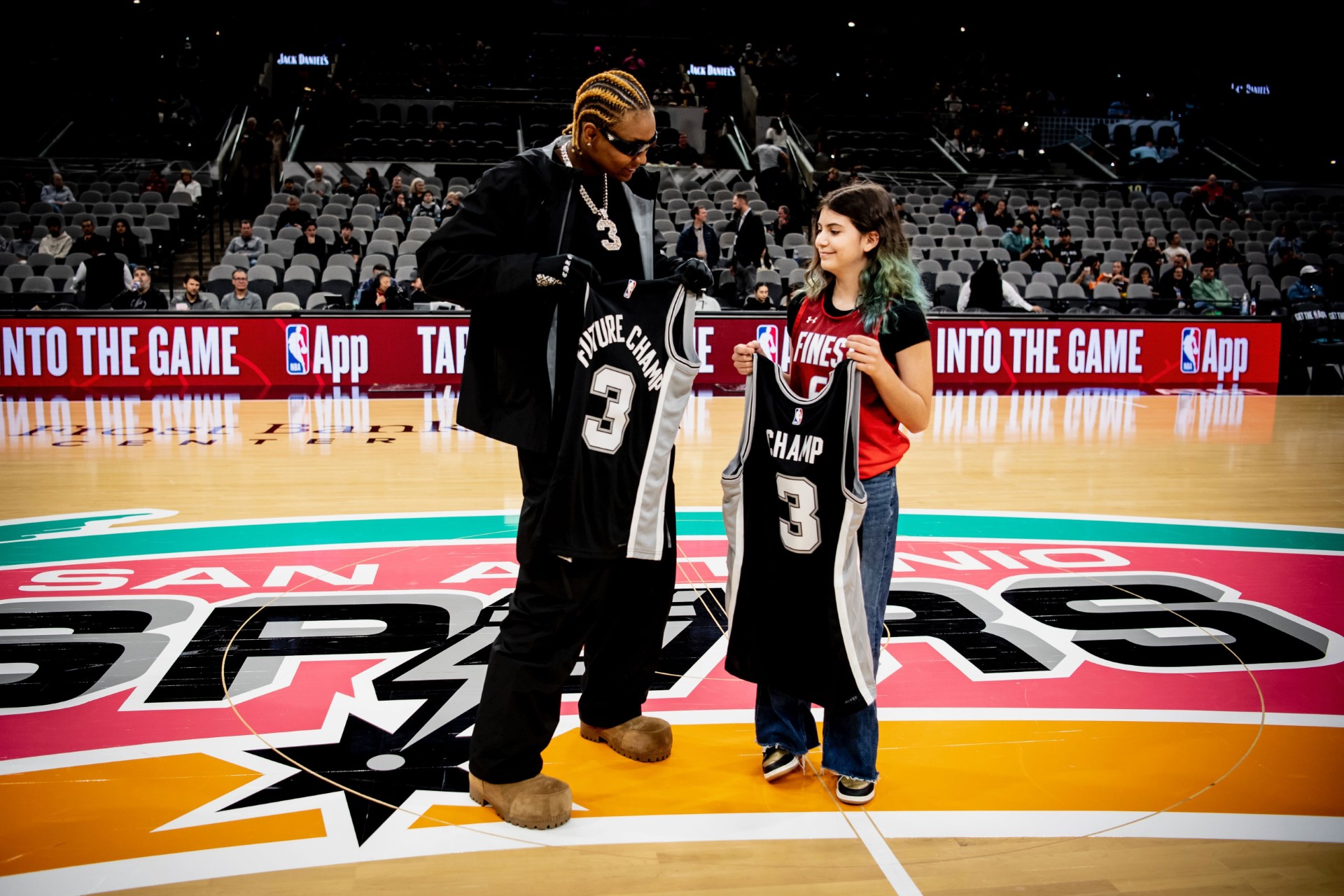 NaLyssa Smith presenting a young fan with a signed jersey